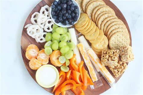 A clearly portioned evening snack sits on a plate beside an empty food package.